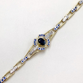 Золотий браслет з синім корундом та білими діамантами 01-19281204