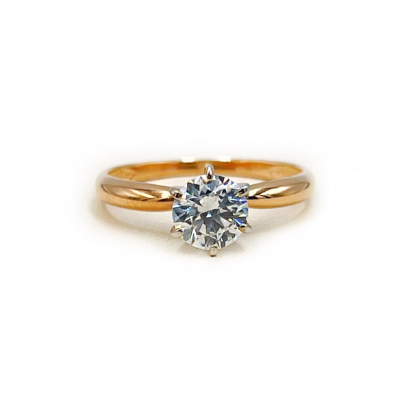 Кольцо из красного с белым золота с цирконом