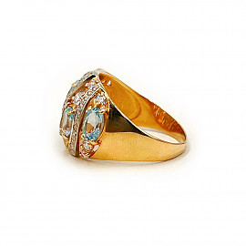 Каблучка з червоного з білим золота з блакитними топазами та цирконом