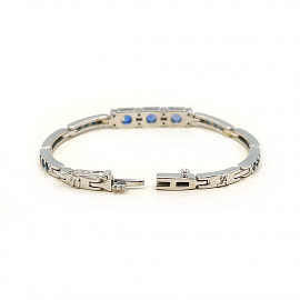 Золотий браслет з синіми корундами