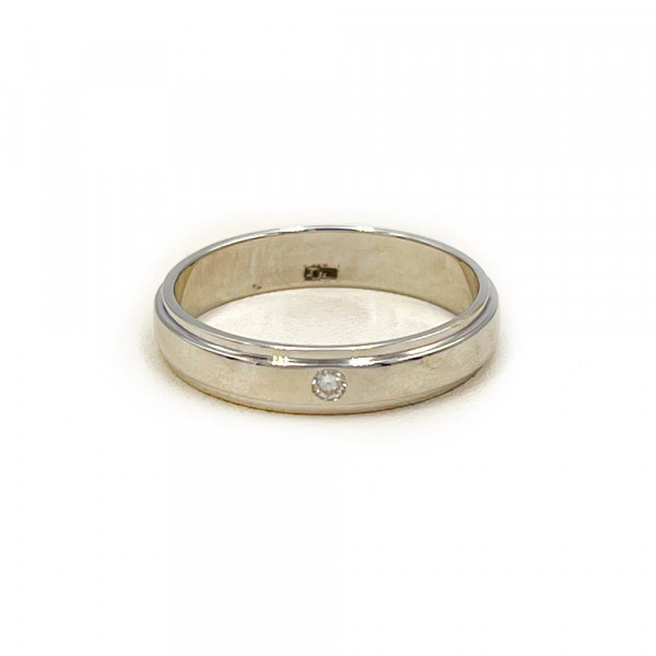 Золота обручка білого кольору з цирконом